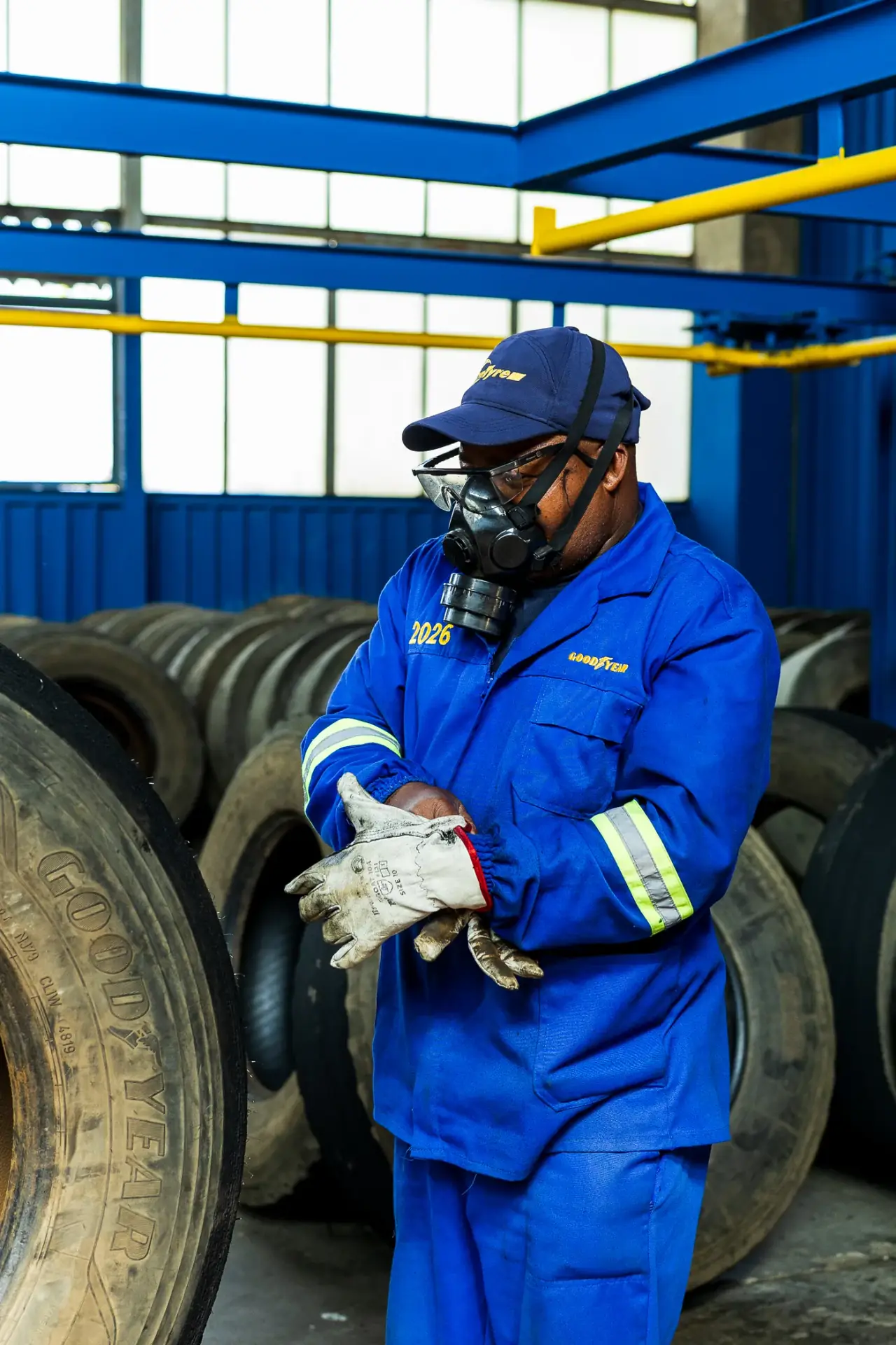 TrenTyre technician among retreaded tyre casings in the workshop